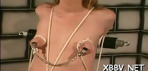  Exposed wife stands tied up and endures heavy breast bondage
